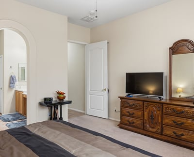 Well-sized primary suite with easy access to ensuite bath, providing comfort,