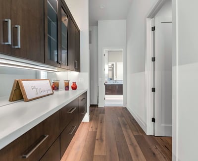 Custom hallway cabinetry with quartz countertop, adding storage and convenience to this well-designed Phoenix home.