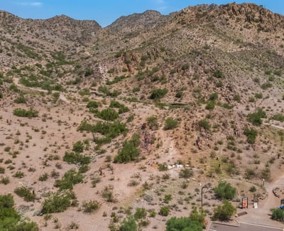 Aerial image of scenic desert trails and rugged terrain, showcasing outdoor recreation options close to this Phoenix property.