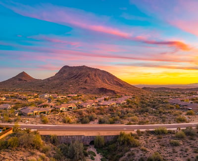 Scottsdale aerial showcasing mountain views, desert terrain, and surrounding community, highlighting the property s prime setting.