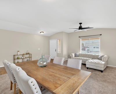 Flexible dining and living area with neutral tones and natural light. Open-concept layout enhances everyday living and entertaining in this Casa Grande home.