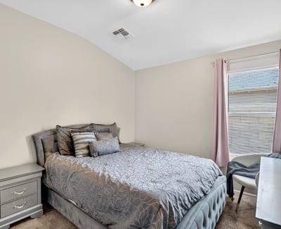 Secondary bedroom offering comfort, natural light, and versatility. Ideal for guests or family in this Casa Grande property.