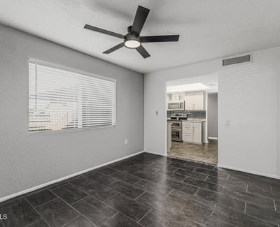 Bright and open room with updated flooring and natural light. This Sun City home offers versatile space to fit your lifestyle needs.