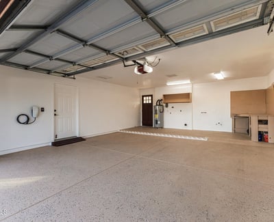 Spacious garage with room for parking, storage, and projects. This Sun City home offers convenience and additional functional space.