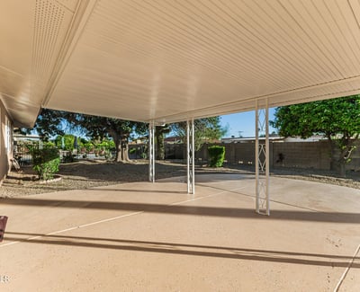 Shaded patio area ideal for relaxing or entertaining outdoors. This Sun City home features low-maintenance yard space and outdoor comfort.