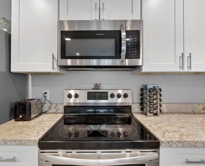 Stylish kitchen with stainless appliances, upgraded counters, and clean cabinetry, offering a move-in-ready cooking space.