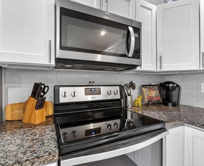 Stylish Scottsdale kitchen showcasing granite counters, stainless appliances, modern cabinetry, and efficient layout ideal for everyday living.