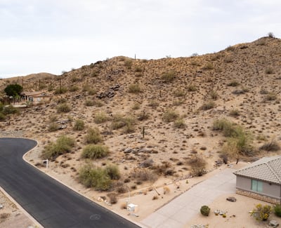 Expansive desert hillside lot offering panoramic mountain scenery and surrounding luxury homes. Located in Phoenix, this elevated property provides the ideal setting for a private custom retreat.