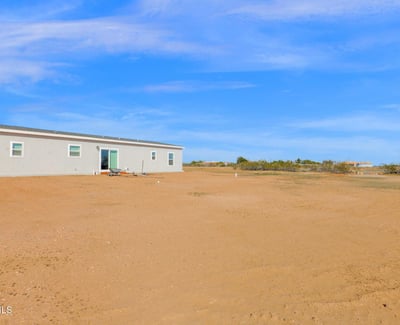 Vast outdoor surroundings provide privacy, scenic desert views, and exceptional flexibility for outdoor enjoyment. The expansive lot complements the home's modern design while embracing the peaceful Wittmann setting.
