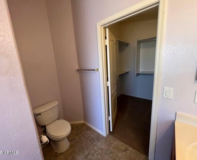 Functional primary bath with convenient access to a spacious walk-in closet. This efficient design enhances organization while providing a seamless owner's suite experience.