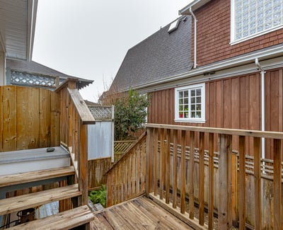 Discover a cozy outdoor space with wood decking, perfect for relaxation or private gatherings.