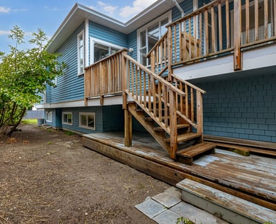 This property features a spacious deck, ideal for outdoor gatherings, and a low-maintenance yard.