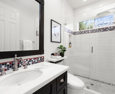 Bathroom 2-Modern bathroom featuring a spacious walk-in shower, sleek fixtures, and vibrant tile accents.