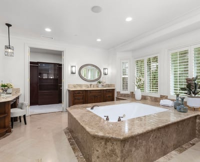 Primary Bathroom -Spacious bathroom featuring a luxurious soaking tub, spacious walk in shower, TV, Toto Neocrest Toilets and a beautifully crafted vanity area. (TV included)