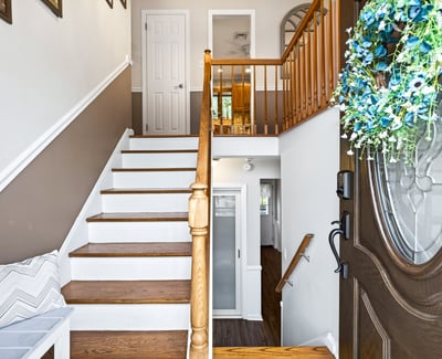 Welcoming entry with staircase up to main rooms.