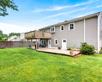 Spacious backyard with large deck and patio.