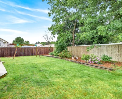 Backyard oasis with flower beds.