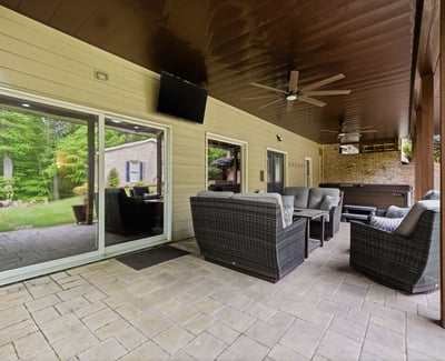 Discover a spacious outdoor patio area perfect for gatherings, complete with comfortable seating and serene views.
