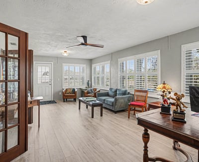 Large Bonus Room, newly repainted with new laminate flooring. An enticing feature of this room is that is has it's own entrance and sidewalk that easily access the rear parking pad. With a storm door and plantation shutters, and lots of space- the previous owners used this room as an office. Could be a large in-law space or a bunkhouse for family and friends that come to visit! Make it your own.