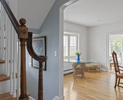 Welcoming foyer leads to an airy dining area, featuring natural light and quality craftsmanship throughout.