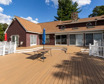 Spacious outdoor deck with shade umbrellas, perfect for entertaining and enjoying leisurely moments in nature.