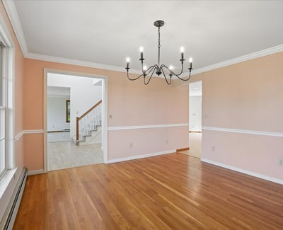 Bright and inviting space featuring hardwood floors, large windows, and an open layout perfect for gatherings.