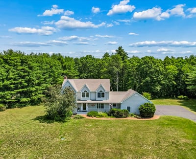 Spacious home on a large lot, surrounded by lush greenery and offering ample outdoor space.