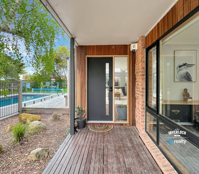Discover modern living with a seamless indoor-outdoor flow, featuring a sleek entry and inviting surroundings.