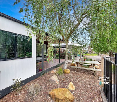 This property features a modern home surrounded by landscaped outdoor spaces ideal for entertaining and relaxation.