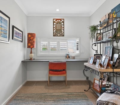 Bright and airy workspace featuring a modern desk, natural light, and personalized decor for inspiration.