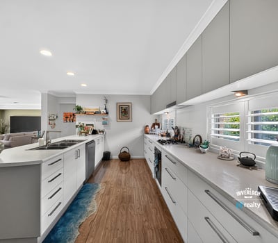 Modern kitchen featuring ample counter space, bright lighting, and a layout ideal for entertaining.