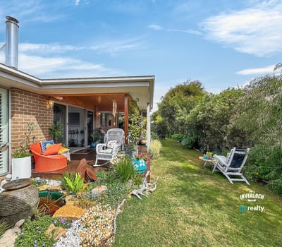 Bright outdoor space featuring lush gardens, inviting seating areas, and a peaceful atmosphere for relaxation.