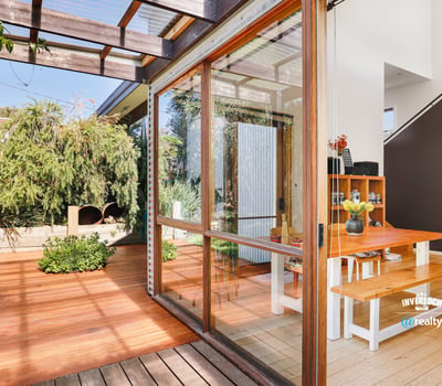 Bright and inviting indoor-outdoor space featuring natural light and a spacious dining area.