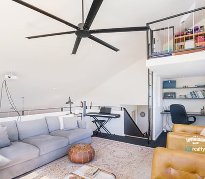 Contemporary loft with abundant natural light, featuring an open layout and versatile office space.
