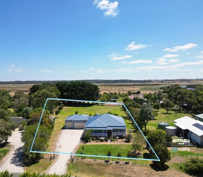 Spacious property featuring a well-maintained home and expansive outdoor space, perfect for relaxation and entertaining.