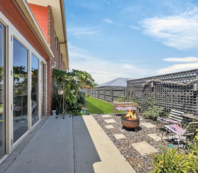 Discover a cozy outdoor space featuring a fire pit, ideal for gatherings and relaxation.