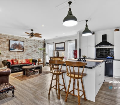 Bright and inviting open-concept living space featuring modern amenities and a cozy atmosphere.