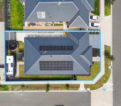Spacious property featuring solar panels, ample yard space, and convenient access to nearby amenities.