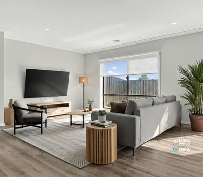 Bright and airy living space featuring modern furnishings and large windows that invite natural light.