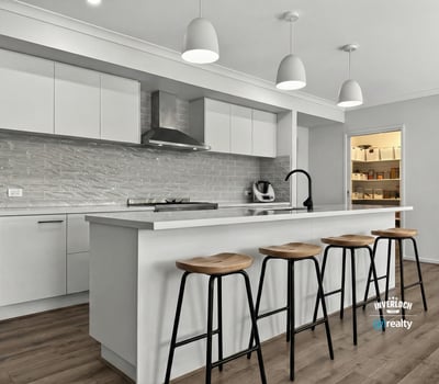 Spacious kitchen featuring modern appliances, a large island, and ample storage for culinary enthusiasts.