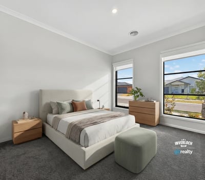 Light-filled bedroom featuring a modern design, spacious layout, and large windows overlooking the neighborhood.