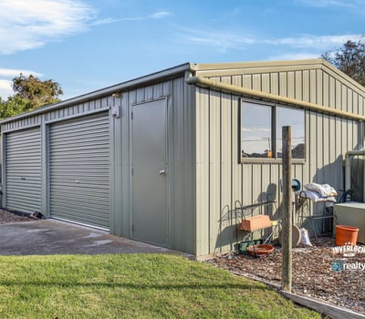 Versatile shed with ample storage space, perfect for workshops, hobbies, or vehicle parking in a convenient location.