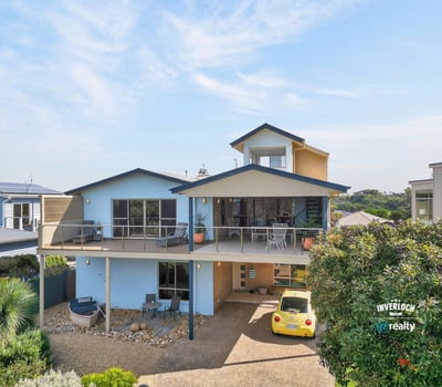 Contemporary coastal home featuring expansive outdoor spaces and panoramic views, perfect for relaxation and entertaining.