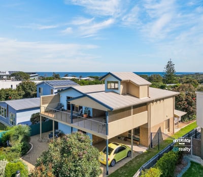 Experience coastal living in this spacious home with stunning ocean views and ample outdoor space.