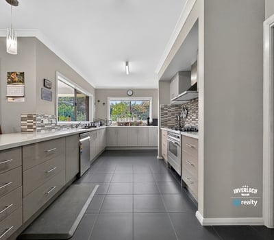 Spacious kitchen featuring modern appliances, ample storage, and natural light, perfect for culinary enthusiasts.