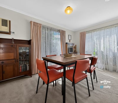 Bright and inviting dining area with ample natural light and a warm, welcoming atmosphere.