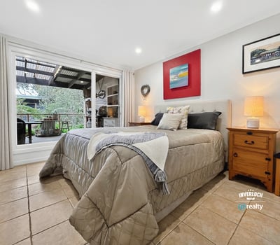 Bright and inviting bedroom featuring direct access to a private outdoor terrace for relaxed living.