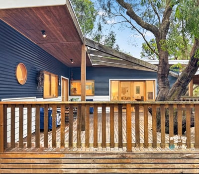 Discover this unique home featuring an open deck, contemporary design, and natural surroundings for optimal outdoor living.