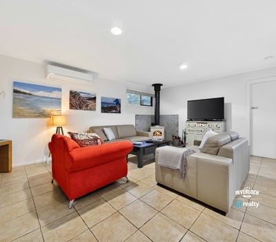 Bright and inviting living space featuring a cozy fireplace, modern furnishings, and ample natural light.