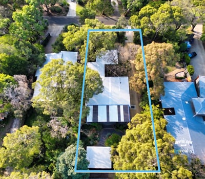 Spacious property surrounded by lush greenery, perfect for those seeking tranquility and ample outdoor space.